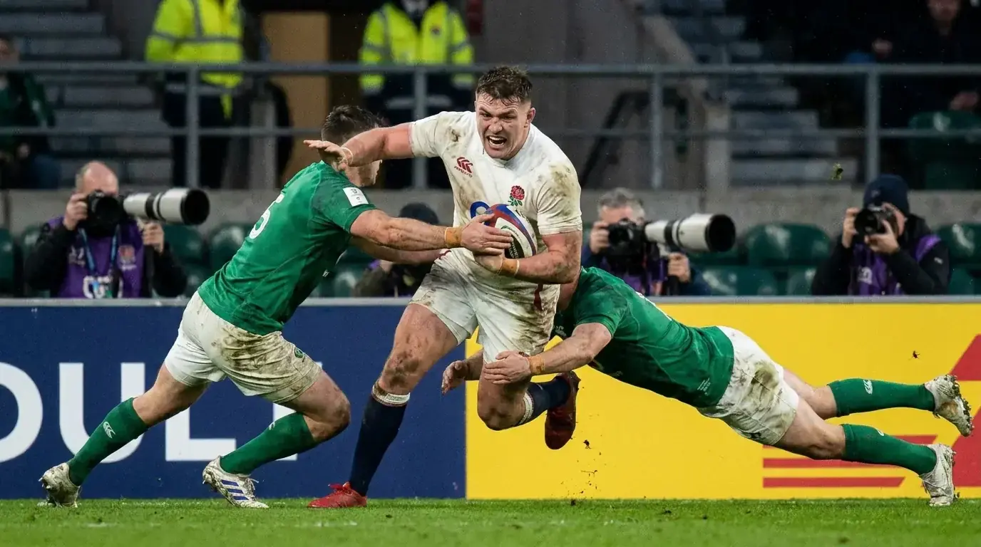 Rugby player breaking through a defensive line during a live televised Premiership match