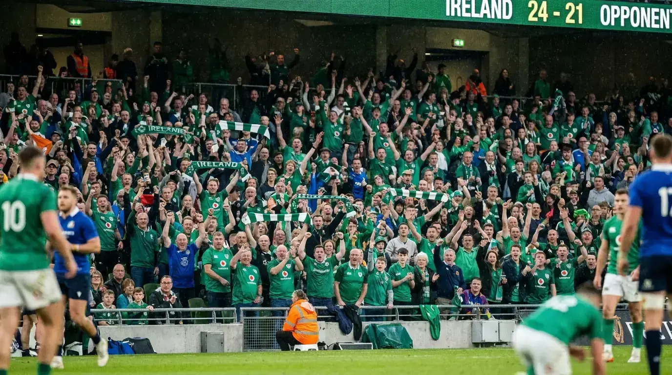 Irish rugby fans in green and blue celebrating a try at a URC fixture