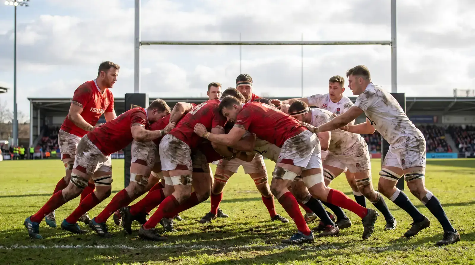 Rugby maul driving over the try line with multiple forwards bound together